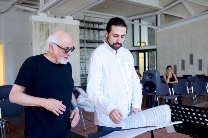 Francesco Bossaglia with composer Morton Subotnick, reading a score together, Florence 2017.
