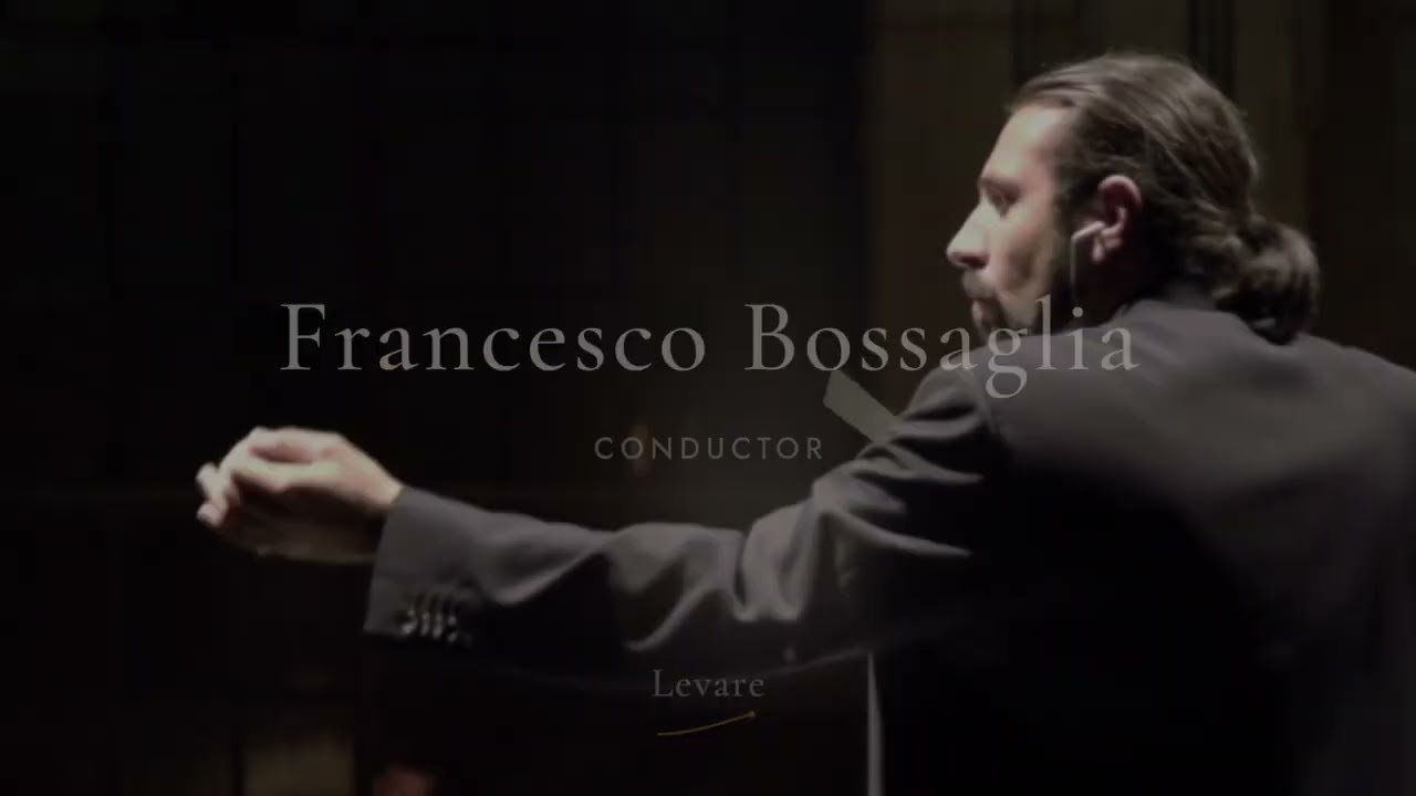 Francesco Bossaglia in profile on a dark stage, arm extended mid-beat, with the reel's title over the frame.